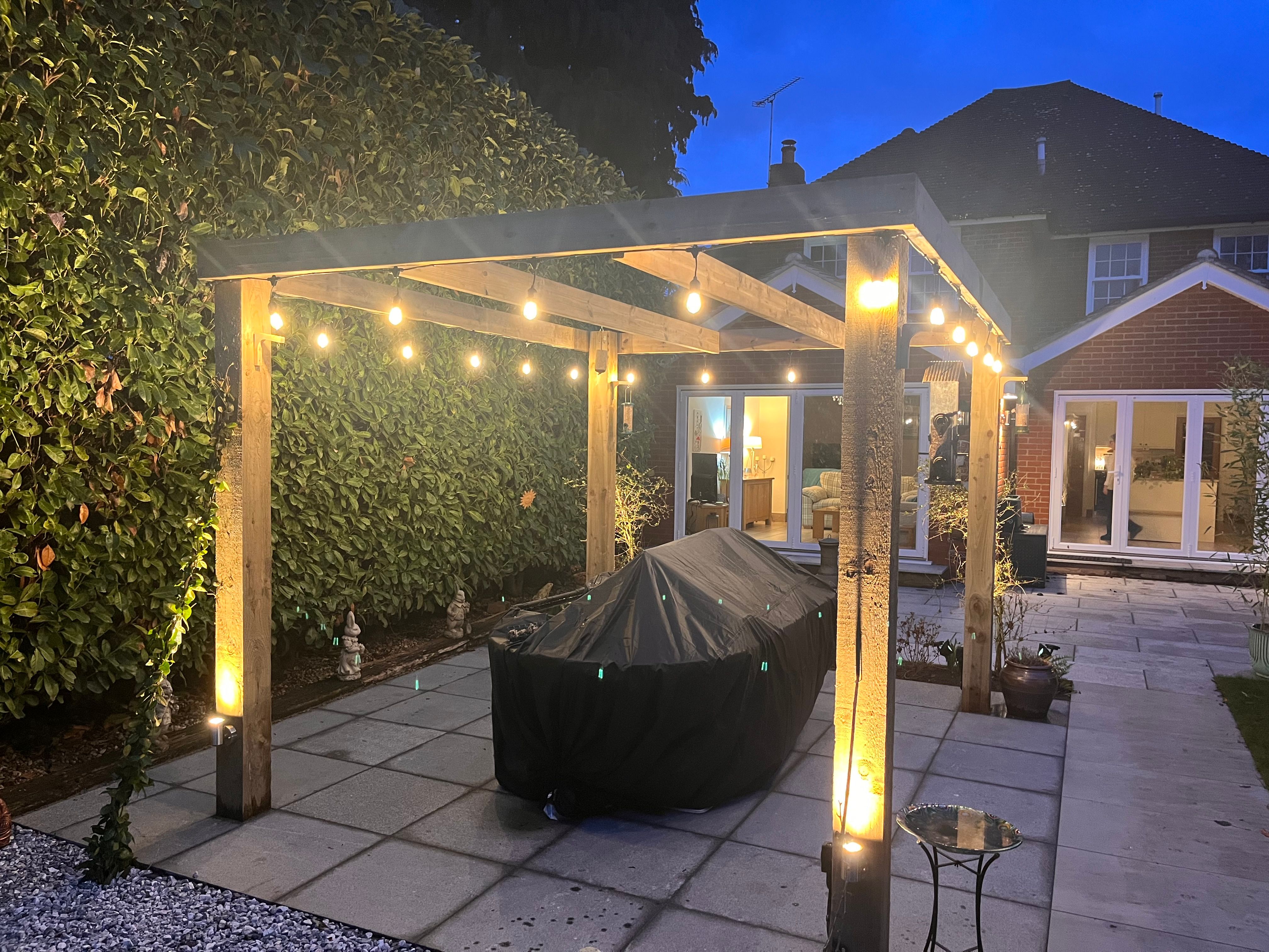 Pergola and garden lighting installation at dusk, Chelmsford